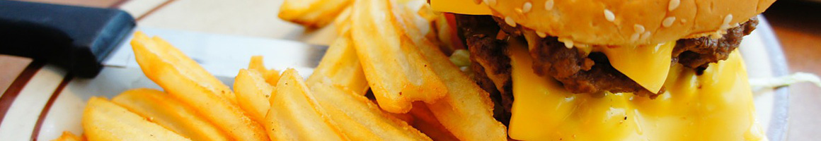 Eating Burger Chicken Wing Chicken at Louie's Chicken Fingers restaurant in Tallassee, AL.